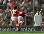 27 July 1997; DJ Carey of Kilkenny put the sliothar past Galway goalkeeper Pat Costello and defender Nigel Shaughnessy, 5, for his side's opening goal during the Guinness All-Ireland Senior Hurling Championship Quarter-Final match between Kilkenny and Galway at Semple Stadium in Thurles, Tipperary. Photo by Ray McManus/Sportsfile