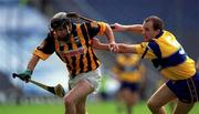 15 August 1999; DJ Carey of Kilkenny is tackled by Liam Doyle of Clare during the Guinness All-Ireland Senior Hurling Championship Semi-Final match between Kilkenny and Clare at Croke Park in Dublin. Photo by Ray McManus/Sportsfile
