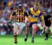 15 August 1999; DJ Carey of Kilkenny in action against Ollie Baker of Clare during the Guinness All-Ireland Senior Hurling Championship Semi-Final match between Kilkenny and Clare at Croke Park in Dublin. Photo by Ray McManus/Sportsfile