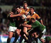 19 June 1999; Daniel Herbert of Australia in action against Peter Clohessy, left, and Trevor Brennan of Ireland during the Ireland Rugby tour to Australia Second Test match between Australia and Ireland at the Subiaco Oval in Perth, Australia. Photo by Matt Browne/Sportsfile