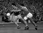 15 April 1990; David Beggy of Meath is tackled by Tony Davis of Cork during the Royal Liver Assurance National Football League Semi-Final match between Meath and Cork at Croke Park in Dublin. Photo by Ray McManus/Sportsfile