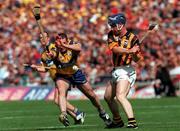 15 August 1999; Denis Byrne of Kilkenny in action against Colin Lynch of Clare during the Guinness All-Ireland Senior Hurling Championship Semi-Final match between Kilkenny and Clare at Croke Park in Dublin. Photo by Damien Eagers/Sportsfile