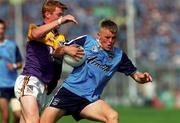 1 August 1999; Stephen Mills of Dublin is tackled by Eric Bradley of Wexford during the Leinster Minor Football Championship Final between Dublin and Wexford at Croke Park in Dublin. Photo by Aoife Rice/Sportsfile