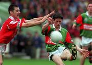 22 August 1999; John Moran of Mayo in action against Ronan Curran of Cork during the All-Ireland Minor Football Championship Semi-Final match between Cork and Mayo at Croke Park in Dublin. Photo by Matt Browne/Sportsfile