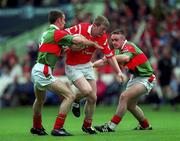 22 August 1999; John Flavin of Cork in action against Paraic Kelly, left, and John Brogan of Mayo during the All-Ireland Minor Football Championship Semi-Final match between Cork and Mayo at Croke Park in Dublin. Photo by Ray McManus/Sportsfile