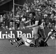 2 September 1983; John Crowley of Cork in action against Billy Fitzpatrick of Kilkenny during the All-Ireland Senior Hurling Championship Final between Kilkenny and Cork at Croke Park in Dublin. Photo by Ray McManus/Sportsfile