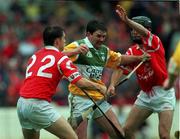 8 August 1999; Offaly's Martin Hanamy is tackled by Alan Browne, 22, and Ben O'Connor of Cork during the Guinness All-Ireland Senior Hurling Championship Semi-Final match between Cork and Offaly at Croke Park in Dublin. Photo by Brendan Moran/Sportsfile