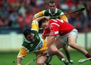 8 August 1999; Martin Hanamy of Offaly is tackled by Cork's Alan Browne during the Guinness All-Ireland Senior Hurling Championship Semi-Final match between Cork and Offaly at Croke Park in Dublin. Photo by Brendan Moran/Sportsfile