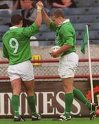 28 August 1999; Matt Mostyn, right, is congratulated by his Ireland team-mate Tom Tierney, 9, after scoring their second try during the Rugby World Cup Warm-up match between Ireland and Argentina at Lansdowne Road in Dublin. Photo by David Maher/Sportsfile