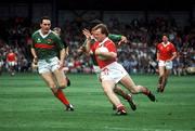 17 September 1989; Teddy McCarthy of Cork in action against Jimmy Browne, left, and Peter Ford of Mayo during the All-Ireland Senior Football Championship Final between Cork and Mayo at Croke Park in Dublin. Photo by Ray McManus/Sportsfile