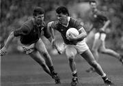 15 April 1990; Michael McCarthy of Cork in action against Robbie O'Malley of Meath during the Royal Liver Assurance National Football League Semi-Final match between Meath and Cork at Croke Park in Dublin. Photo by Ray McManus/Sportsfile