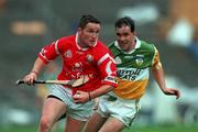 8 August 1999; Michael O'Connell of Cork in action against Johnny Pilkington of Offaly during the Guinness All-Ireland Senior Hurling Championship Semi-Final match between Cork and Offaly at Croke Park in Dublin. Photo by Ray McManus/Sportsfile