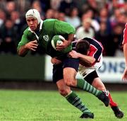 10 September 1999; Mike Mullins of Ireland is tackled by John Kelly of Munster during the Representative Match between Munster and Ireland XV at Musgrave Park in Cork. Photo by Matt Browne/Sportsfile