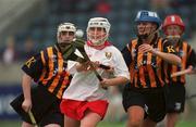 7 August 1999; Miriam Deasy of Cork in action against Tracey Millea of Kilkenny during the Bórd na Gaeilge All-Ireland Senior Camogie Championship Semi-Final match between Kilkenny and Cork at Parnell Park in Dublin. Photo by Ray McManus/Sportsfile