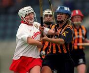 7 August 1999; Miriam Deasy of Cork in action against Tracey Millea of Kilkenny during the Bórd na Gaeilge All-Ireland Senior Camogie Championship Semi-Final match between Kilkenny and Cork at Parnell Park in Dublin. Photo by Ray McManus/Sportsfile