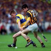 15 August 1999; Niall Gilligan of Clare in action against Philip Larkin of Kilkenny during the Guinness All-Ireland Senior Hurling Championship Semi-Final match between Kilkenny and Clare at Croke Park in Dublin. Photo by Brendan Moran/Sportsfile