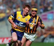 15 August 1999; Niall Gilligan of Clare is tackled by Canice Brennan of Kilkenny during the Guinness All-Ireland Senior Hurling Championship Semi-Final match between Kilkenny and Clare at Croke Park in Dublin. Photo by Damien Eagers/Sportsfile
