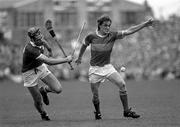 12 July 1987; Nicky English, Tipperary, after losing his hurl, in action against Cork's Richard Browne during the Munster Senior Hurling Championship Final between Tipperary and Cork at Semple Stadium in Thurles, Tipperary. Photo by Ray McManus/Sportsfile