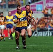 15 August 1999; Ollie Baker of Clare is tackled by Andy Comerford of Kilkenny during the Guinness All-Ireland Senior Hurling Championship Semi-Final match between Kilkenny and Clare at Croke Park in Dublin. Photo by Damien Eagers/Sportsfile