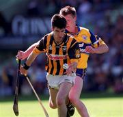 15 August 1999; Philip Larkin of Kilkenny in action against Niall Gilligan of Clare during the Guinness All-Ireland Senior Hurling Championship Semi-Final match between Kilkenny and Clare at Croke Park in Dublin. Photo by Ray McManus/Sportsfile