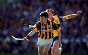 15 August 1999; Philip Larkin of Kilkenny in action against Niall Gilligan of Clare during the Guinness All-Ireland Senior Hurling Championship Semi-Final match between Kilkenny and Clare at Croke Park in Dublin. Photo by Ray McManus/Sportsfile