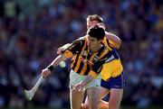 15 August 1999; Philip Larkin of Kilkenny in action against Niall Gilligan of Clare during the Guinness All-Ireland Senior Hurling Championship Semi-Final match between Kilkenny and Clare at Croke Park in Dublin. Photo by Ray McManus/Sportsfile