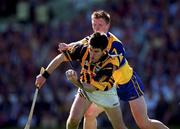 15 August 1999; Philip Larkin of Kilkenny in action against Niall Gilligan of Clare during the Guinness All-Ireland Senior Hurling Championship Semi-Final match between Kilkenny and Clare at Croke Park in Dublin. Photo by Ray McManus/Sportsfile