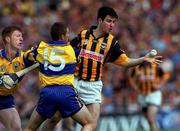 15 August 1999; Philip Larkin of Kilkenny in action against Alan Markham, 15, and Niall Gilligan of Clare during the Guinness All-Ireland Senior Hurling Championship Semi-Final match between Kilkenny and Clare at Croke Park in Dublin. Photo by Damien Eagers/Sportsfile