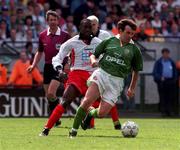 17 May 1998; Ray Houghton of Republic of Ireland in action against Dwight York International XI during the Paul McGrath Testimonial match between Republic of Ireland XI and International XI at Lansdowne Road in Dublin. Photo by Brendan Moran/Sportsfile