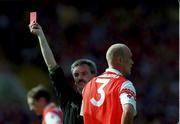 29 August 1999; Referee Paddy Russell issues a red card to Gerard Reid of Armagh during the Bank of Ireland All-Ireland Senior Football Championship Semi-Final match between Meath and Armagh at Croke Park in Dublin. Photo by Brendan Moran/Sportsfile