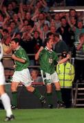 1 September 1999; Robbie Keane celebrates after scoring the Republic of Ireland's opening goal, alongside team-mate Denis Irwin, left, during the UEFA European Championships Qualifying Group 8 match between Republic of Ireland and Yugoslavia at Lansdowne Road in Dublin. Photo by David Maher/Sportsfile