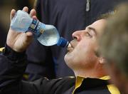 21 September 2006; Paul McGinley, Team Europe 2006, takes a drink during the official team photocall. 36th Ryder Cup Matches, K Club, Straffan, Co. Kildare, Ireland. Picture credit: Matt Browne / SPORTSFILE