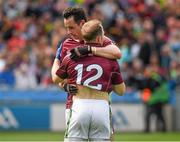 3 August 2014; Galway full back Finian Hanley and Kerry substitute Darren O'Sullivan, wearing the Galway 12 jersey, embrace after the game. GAA Football All-Ireland Senior Championship, Quarter-Final, Kerry v Galway, Croke Park, Dublin. Picture credit: Ray McManus / SPORTSFILE