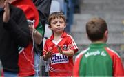 3 August 2014; A young Cork supporter applauds the end of the national anthem as a young Mayo supporter walks by. GAA Football All-Ireland Senior Championship, Quarter-Final, Mayo v Cork, Croke Park, Dublin. Picture credit: Brendan Moran / SPORTSFILE