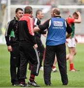 3 August 2014; Mayo selector Tom Prendergast, left, has words with Cork selector Ronan McCarthy and manager Brian Cuthbert, after the final whistle. GAA Football All-Ireland Senior Championship, Quarter-Final, Mayo v Cork, Croke Park, Dublin. Picture credit: Brendan Moran / SPORTSFILE