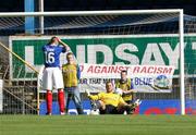 23 September 2006; Aidan O'Kane holds his head after scoring a own goal against goalkeeper Alan Mannus, Linfield. Carnegie Premier League, Linfield v Cliftonville, Windsor Park, Belfast. Picture credit: Oliver McVeigh / SPORTSFILE