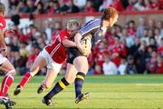 23 September 2006; Simon Keogh,Leinster, is tackled by, is tackled by Dwayne Peel, Llanelli Scarlets. Magners Celtic League 2006 - 2007, Llanelli Scarlets v Leinster, Stradley Park, Wales. Picture credit: Tim Parfitt / SPORTSFILE