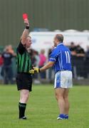 24 September 2006; Barry O'Hagan Clann Na Gael, is shown the red card by referee Jim Slevin. Nugent Catering Supplies Armagh Senior Football Championship Final, Crossmaglen v Clann Na Gael, Oliver Plunkett Park, Crossmaglen, Co Armagh. Picture credit: Russell Pritchard / SPORTSFILE