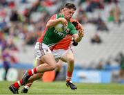 3 August 2014; Fionán Duffy, Mayo, in action against Cathal Donnelly, Armagh. Electric Ireland GAA Football All Ireland Minor Championship, Quarter-Final, Mayo v Armagh, Croke Park, Dublin. Picture credit: Brendan Moran / SPORTSFILE