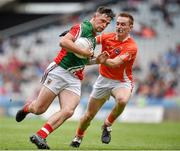 3 August 2014; Fionán Duffy, Mayo, in action against Cathal Donnelly, Armagh. Electric Ireland GAA Football All Ireland Minor Championship, Quarter-Final, Mayo v Armagh, Croke Park, Dublin. Picture credit: Brendan Moran / SPORTSFILE