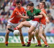 3 August 2014; Fionán Duffy, Mayo, in action against Cathair McKinney, left, and Cathal Donnelly, Armagh. Electric Ireland GAA Football All Ireland Minor Championship, Quarter-Final, Mayo v Armagh, Croke Park, Dublin. Picture credit: Brendan Moran / SPORTSFILE