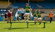 4 August 2014; Dan O'Donohue, Kerry, jumps over the team bench after leading out his team-mates for their photographer before the game. Electric Ireland GAA Football All-Ireland Minor Championship Quarter-Final, Kerry v Kildare, Semple Stadium, Thurles, Co. Tipperary. Picture credit: Barry Cregg / SPORTSFILE