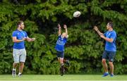 6 August 2014; Jasper Kelly, from Tinahely, Co. Wicklow, reaches for a ball with Leinster players Dominic Ryan, left, and Noel Reid during The Herald Leinster Rugby Summer Camps in Gorey RFC, Gorey, Co. Wexford. Picture credit: Matt Browne / SPORTSFILE