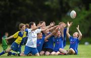 6 August 2014; Siofra Lawlor, from Gorey, reaches for a ball with, from left, Evun Grant, Matthew Howard, Luke Bursey, Sam Kelly, Callum Popplewell, Cathal Byrne and Conor Killoch during The Herald Leinster Rugby Summer Camps in Gorey RFC, Gorey, Co. Wexford. Picture credit: Matt Browne / SPORTSFILE