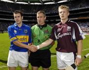 3 September 2006; Galway captain Joe Canning, right, and Tipperary captain Joey McLoughney shake hands in front of referee Dominic Connolly. ESB All-Ireland Minor Hurling Championship Final, Galway v Tipperary, Croke Park, Dublin. Picture credit: Ray McManus / SPORTSFILE