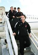 26 September 2006; Derry City players Seamus O'Flynn, Ciaran Martyn and Darren Kelly arrive at Charles De Gaulle Airport ahead of their UEFA Cup First Round, Second Leg game against Paris St Germain. Charles De Gaulle Airport, Paris, France. Picture credit: Oliver McVeigh / SPORTSFILE