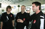 26 September 2006; Derry City's Darren Kelly, right, videos his team-mates Pat McCourt, left, and Sean Hargan, as they arrive at Charles De Gaulle Airport ahead of their UEFA Cup First Round, Second Leg, game against Paris St Germain. Charles De Gaulle Airport, Paris, France. Picture credit: Oliver McVeigh / SPORTSFILE
