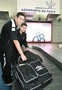 26 September 2006; Derry City players Peter Hutton and Eddie McCallion collect their bags after arriving at Charles De Gaulle Airport ahead of their UEFA Cup First Round, Second Leg, game against Paris St Germain. Charles De Gaulle Airport, Paris, France. Picture credit: Oliver McVeigh / SPORTSFILE