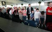 26 September 2006; Derry City manager Stephen Kenny waits among the fans to collect their baggage after arriving at Charles De Gaulle Airport ahead of their UEFA Cup First Round, Second Leg, game against Paris St Germain. Charles De Gaulle Airport, Paris, France. Picture credit: Oliver McVeigh / SPORTSFILE