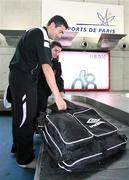 26 September 2006; Derry City players Peter Hutton and Eddie McCallion collect their baggage on arrival at Charles De Gaulle Airport ahead of their UEFA Cup First Round, Second Leg, game against Paris St Germain. Charles De Gaulle Airport, Paris, France. Picture credit: Oliver McVeigh / SPORTSFILE